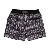 Black Label edition mens swim shorts in black with a white geometric repeat patter. Complete with black waistband and secure zip pocket on the back