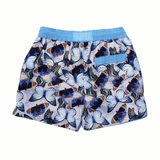 Butterfly Kids swim short in pale lavender-silver with cool, pale blue and navy butterfly print complete with blue drawstring waistband and velcro pocket at the back