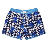 Mens blue and white geo pattern swim shorts with ice cream cone print in eco-friendly greige polyester. Complete with blue drawstring waistband and chlorine-protected metal toggles.