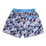 Butterfly patterned swim shorts in pale-silver-lavender with light blue and navy butterflies. featuring a blue drawstring waistband with brand logo at the back.Printed using ocean friendly process