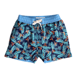 Navy Blue boys swim shorts with tropical green leaf pattern & orange flowers on a Navy background. Sustainable swim trunks print in eco-friendly dyed greige polyester.