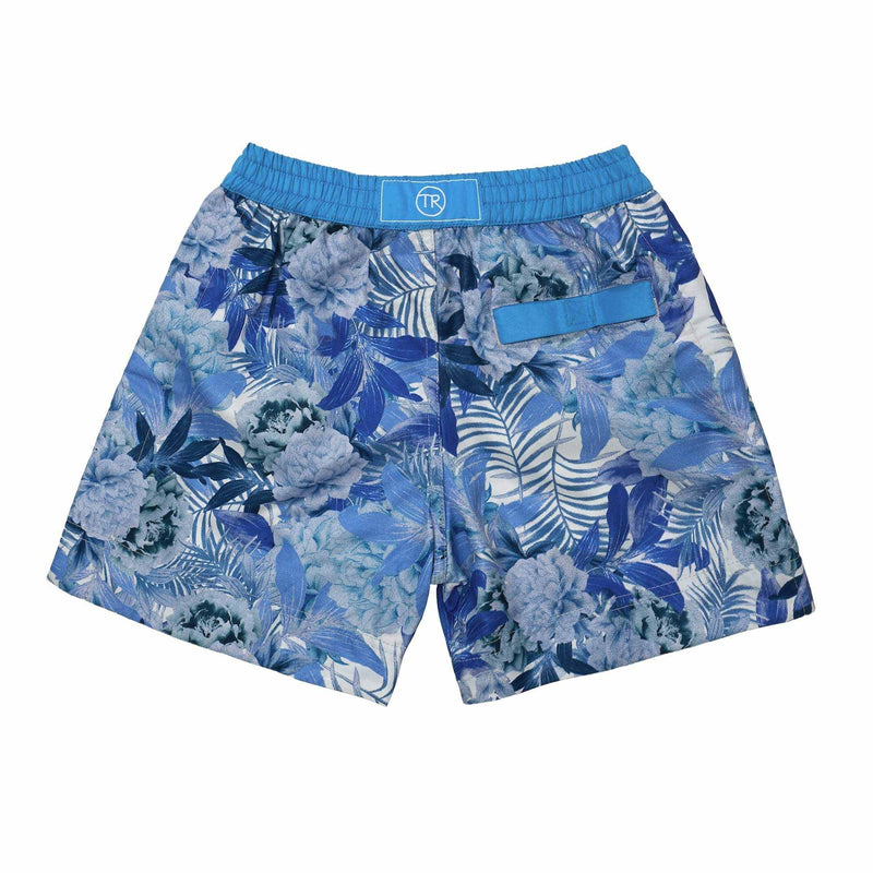 Argentina' kids swim shorts features a contrasting floral leaf design. This 'Luca' style features our signature Thomas Royall blue waistband.
