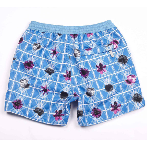 Our 'Bahamas Floral' kids shorts featuring a geometric and contrasting flower design. Matching men's available in Luca and George designs.
