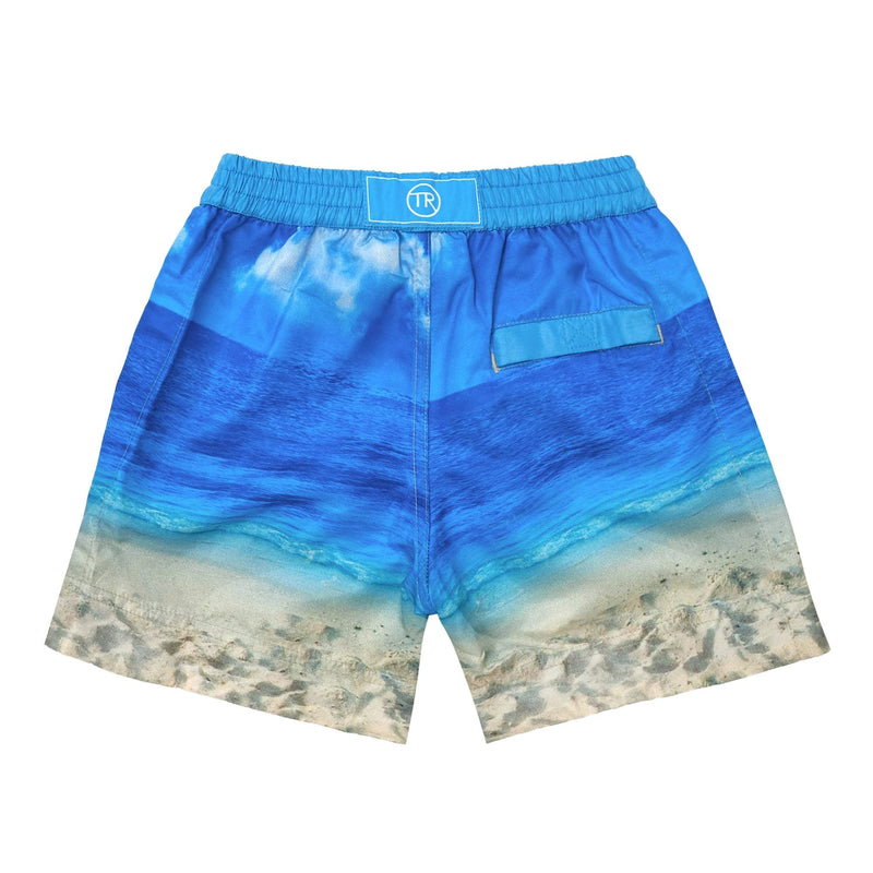 Beach Bulldog' kids shorts showcasing an iconic French dog and beach scene. This 'Luca' style features our signature Thomas Royall blue waistband.