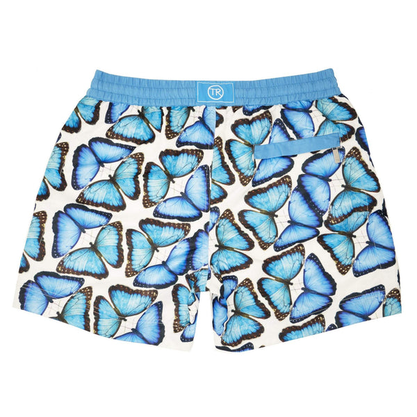 Our signature 'Bermuda' kids shorts featuring our iconic large scattered butterflies in cooling shades of blue.
