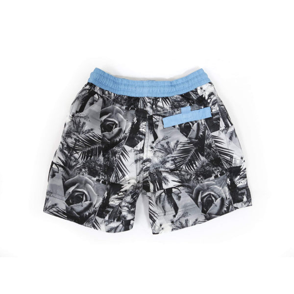 Our limited edition 'Florida' kids shorts featuring a triangle black and white rose design. The 'Luca' fit features our signature Thomas Royall blue waistband. Matching Mens George short available.