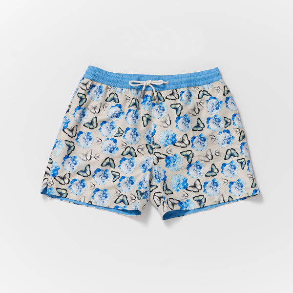 Matching mens and boys Thomas Royall swim shorts in silver grey with blue butterfly pattern and blue waistband