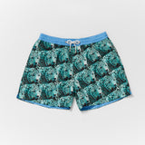 Mens designer swim shorts in blue green leopard design with blue waistband detail