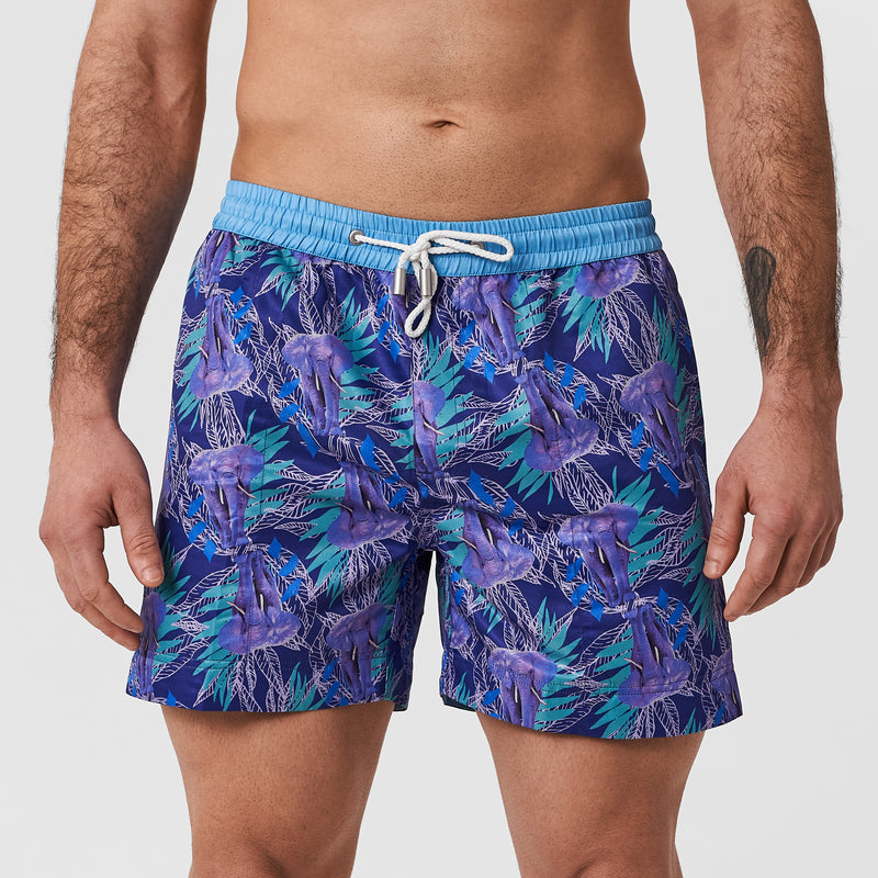 dark purple elephant safari print swim shorts with green leaf detail