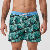 matching swim shorts for men and kids with bold pattern in blue green featuring an Asia Leopard photo