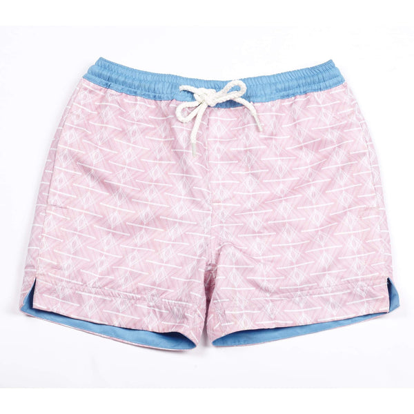 Our 'Queensland' kids shorts featuring a pink and white geometric design.